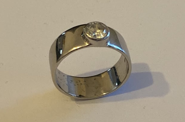 Platinum wide band diamond ring